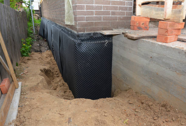 Happy homeowners after waterproofing job in Stanton